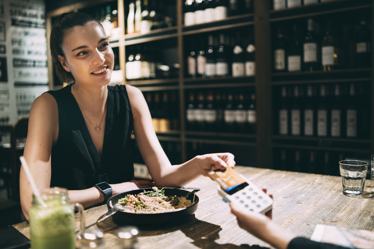 Entrepreneur putting a business dinner on her credit card
